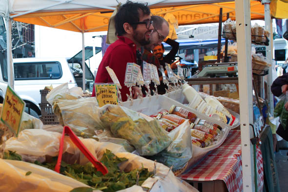 Giovanni Saldarriaga greets a customer at the Hawthorne Valley Farm Stand. Photo: Amber Jamieson. 