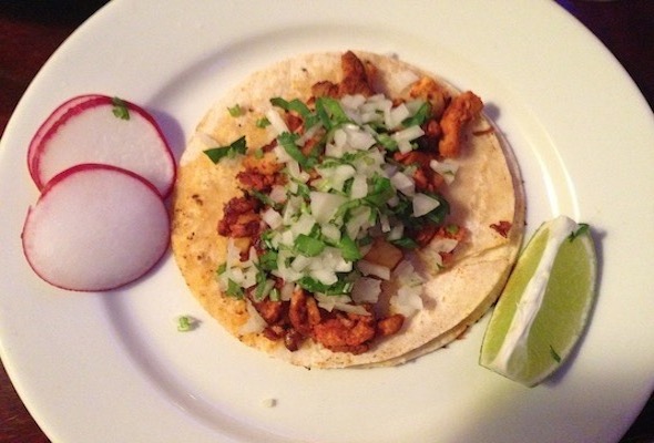 Mexico 2000's roasted pork tacos, sprinkled with cilantro and sautéed pineapple. These $3 tacos are served at both a sit-down restaurant and a hole-in-the wall bodega off the J Train on Marcy Avenue. Photo: Lisa Spear.