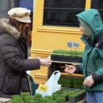 Stewart Borowsky, better known as the "Union Square Grass Man" sells wheatgrass to customer. Photo: Mayah Collins