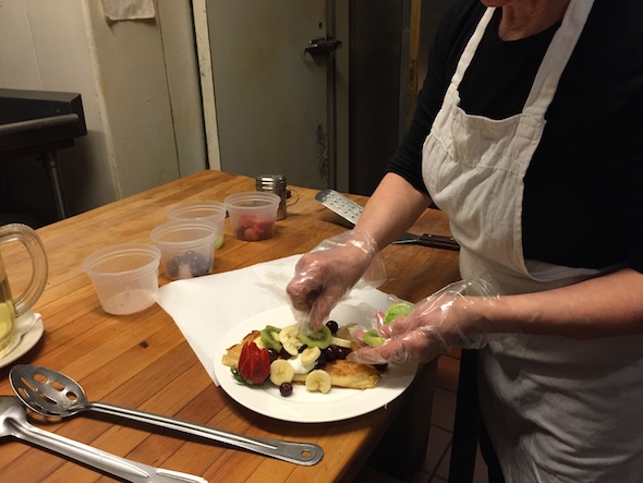 Chef Janina prepares cheese blintzes in the kitchen. Photo: Brittany Robins