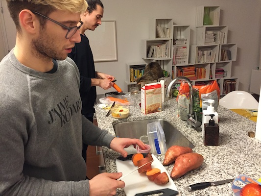 Kopel slices the squash while bone scrapes the carrots. Photo: Brittany Robins.