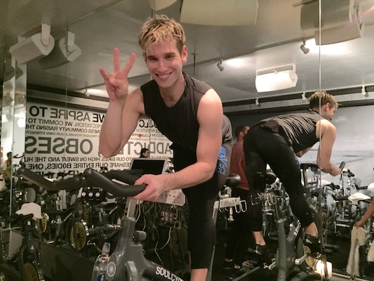 Danny Kopel strikes a pose on his instructor bike following a SoulCycle class in Union Square. Photo: Brittany Robins.