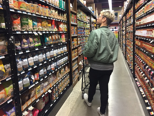 Kopel peruses the grocery aisle for quinoa. Photo: Brittany Robins.