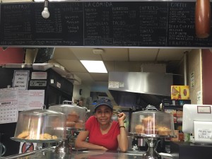 Ignacia Hernandez waits at the register for afternoon guests to arrive at Sweet Life Pastry, in Washington Heights. All sweets on the menu are homemade from scratch by Hernandez. Photo: Sanaz Rizlenjani.