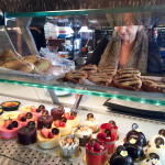Owner Leslie Bernat fills orders behind the dessert counter. Photo: Raquel Wildes.
