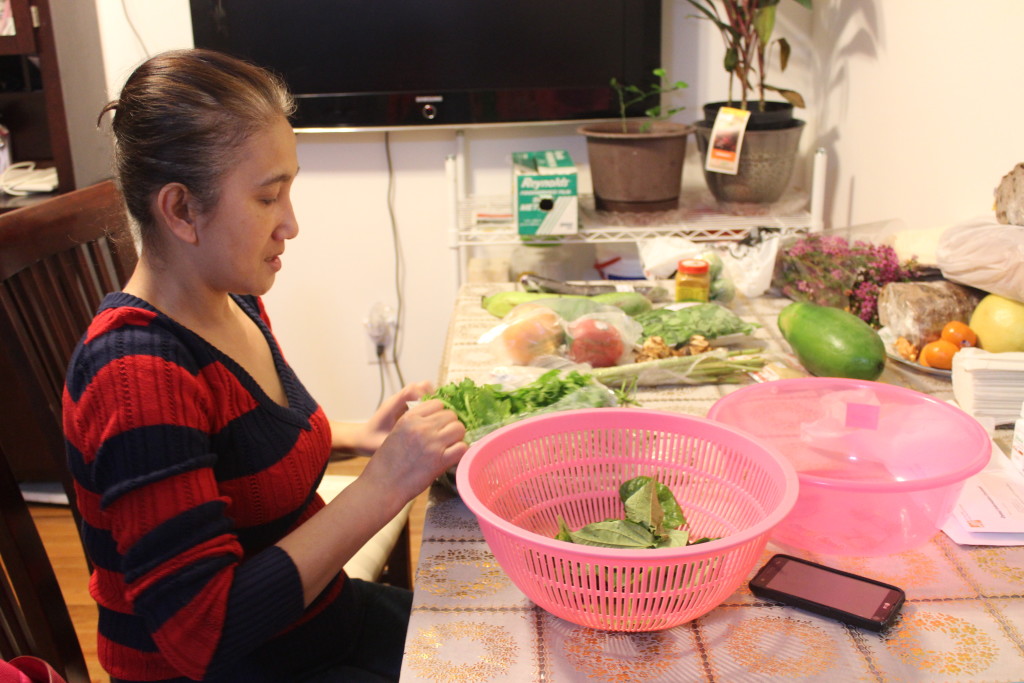 Bolnarin San prepares the dinner as usual in her home. Photo: Xinyu Jing.