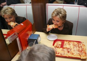 Democratic presidential hopeful, Sen. Hillary Rodham Clinton, D-N.Y., eats pizza during a lunch stop at Revello's Cafe Pizzeria, while campaigning in Old Forge, Penn., Monday, March 10, 2008. (AP Photo/Carolyn Kaster)
