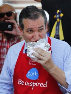 Republican presidential candidate, Sen. Ted Cruz, R-Texas, eats a pork chop at the Iowa State Fair, Friday, Aug. 21, 2015, in Des Moines, Iowa. (AP Photo/Paul Sancya)