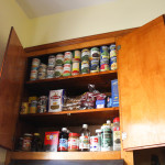 The cans Blanca gets from the food pantry are stored in a very organized fashion. Photo: Roxanne Wang.