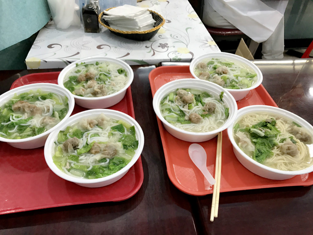 Breakfast, meat noodle with wonton and lettuce, was free to workers. Photo: Senhao Liu.