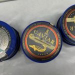 Paramount Caviar tins inside Paramount's Queens headquarters. Photo: Emily Malcynsky.